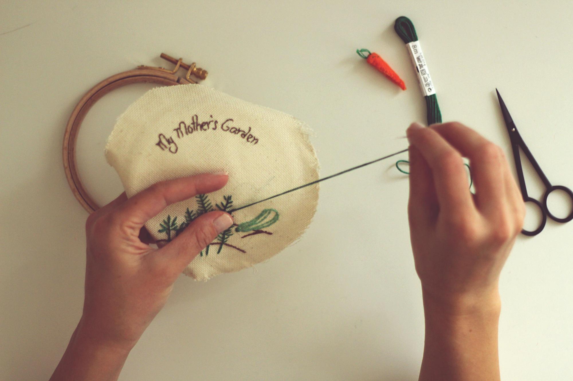 Hand holding embroidered emblem